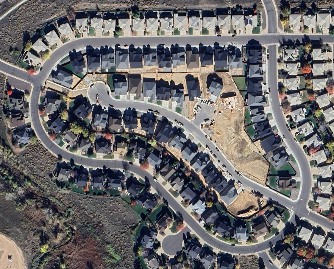 Aerial view of Westridge — single family homes along curved streets in Highlands Ranch
